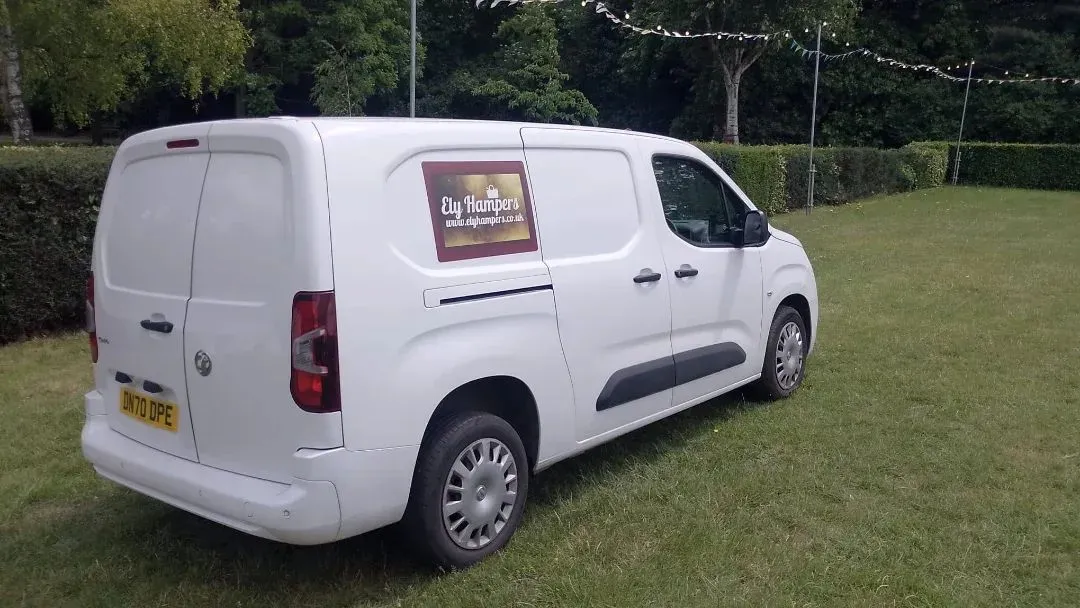 The Ely Hampers van parked under festoon lights ready for a delivery